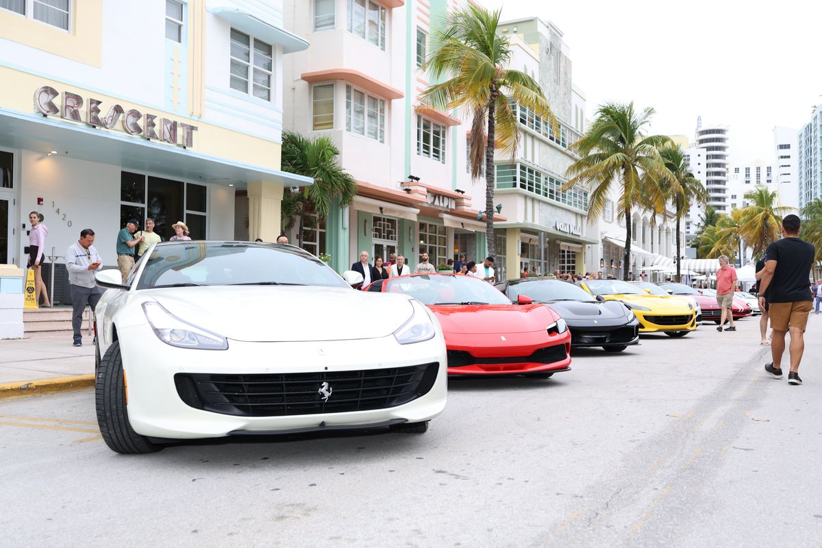 Luxury cars lined up on Ocean Drive, Miami Beach